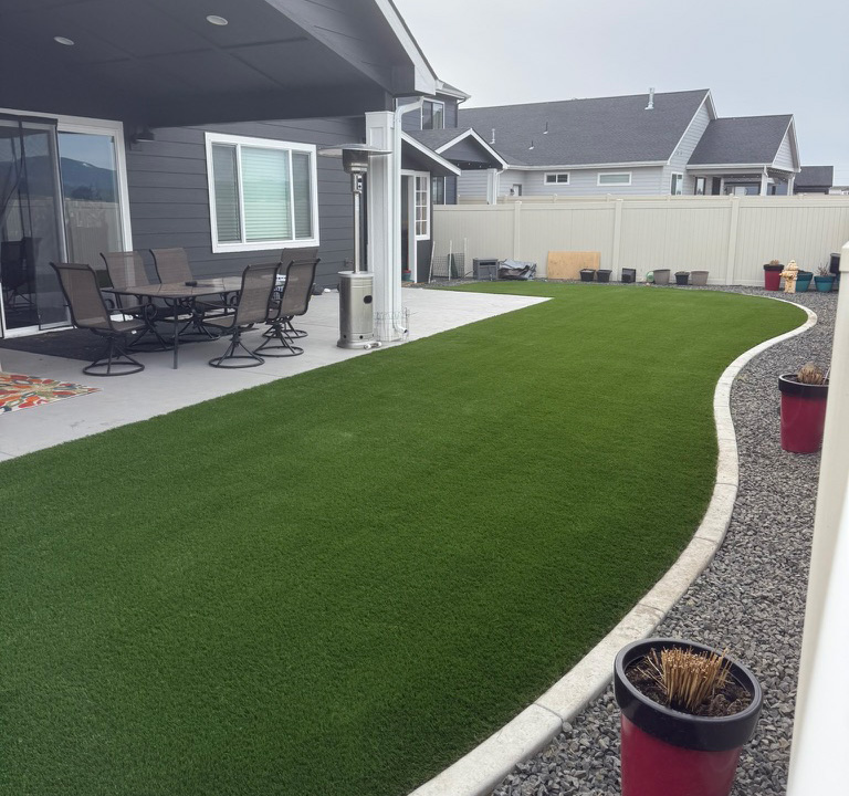 Artificial turf on the backyard of a home.